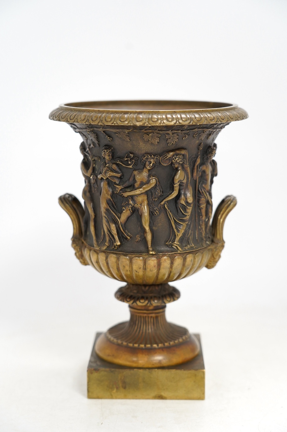 A mid 19th century bronze campana urn with classical figures, 22cm high. Condition - good